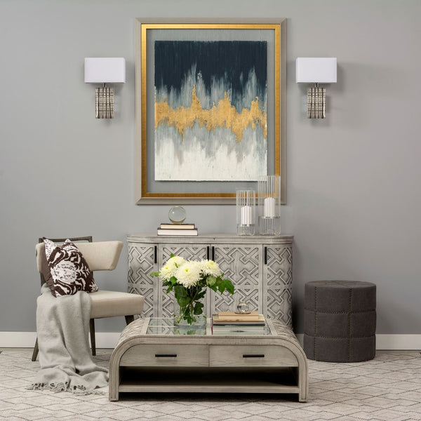 Mercana Beacon Round Ottoman: Plush Chic Seating with Glam Metal Accents for Modern Living Spaces Gray Fabric 50272