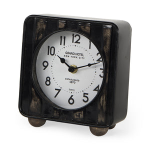 Mercana Karl 6.0L x 3.0W x 6.8H Rustic Black Iron Rounded Square Table Clock 69487