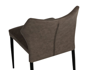 Sunpan James Stackable Faux Leather Dining Chair with Sculpted Back and Industrial Steel Legs 113223