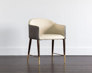 Sunpan Kylin Dining Armchair: Modern Barrel Back Design in Cream Faux Leather with Brass Steel Legs
