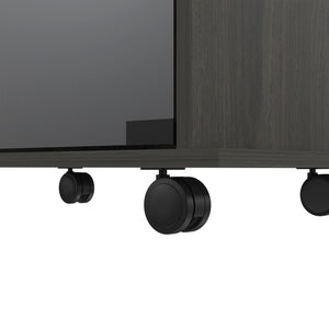 English Elm Vegas Two-Tier Bar Cart with Glass Door, Six Liquor Cubbies, Lockable Wheels & Metal Rails B128P176150