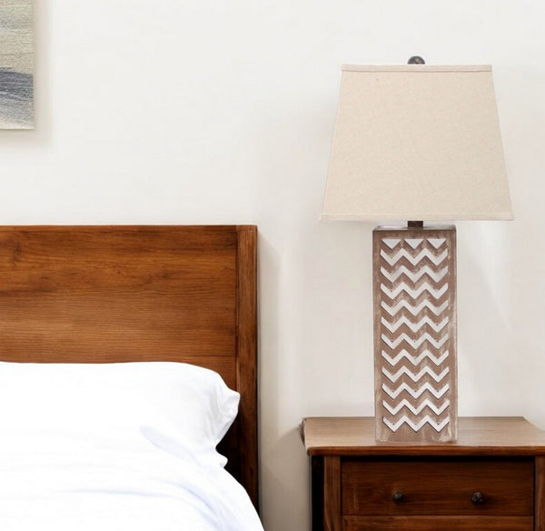HomeRoots 28" Distressed Natural and Silver Metal Bedside Lamp with Beige Cone Shade for Cozy Lighting Decor 274468