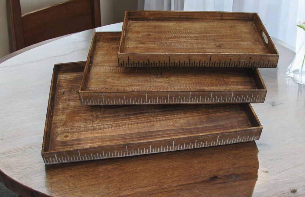 HomeRoots Set of Three Rustic Brown Wood Nesting Serving Trays with Cutout Handles for Stylish Display 274824