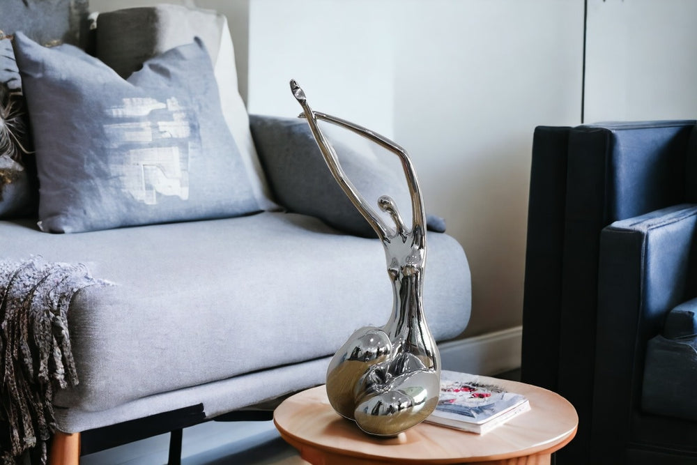 Homeroots 24" Silver Polyresin Sculpture  Polyresin 284041