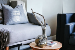 Homeroots 24" Silver Polyresin Sculpture  Polyresin 284041