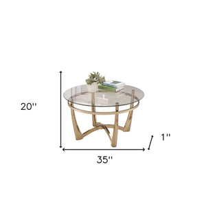 Homeroots 35" Clear And Champagne Glass And Metal Round Coffee Table   286053