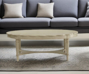 HomeRoots 50" Antiqued White Oval Coffee Table - Distressed Solid Wood Centerpiece for Rustic Farmhouse Decor 286349