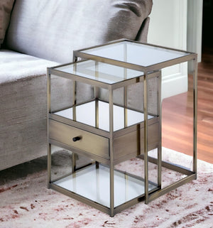 Homeroots Set Of Two 26" Brass And Clear Glass And Iron End Table With Drawer And Two Shelves With Magazine Holder   286376