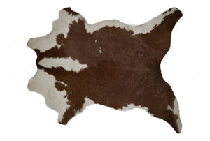 HomeRoots 2' X 3' Hand-Tufted Brown and White Cowhide Print Area Rug - Rustic Charm for Any Space! 293165