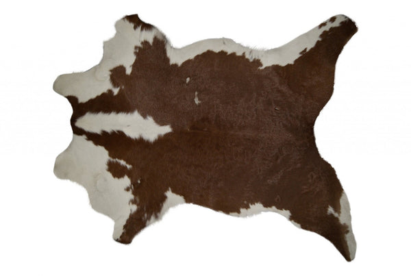 HomeRoots 2' X 3' Hand-Tufted Brown and White Cowhide Print Area Rug - Rustic Charm for Any Space! 293165