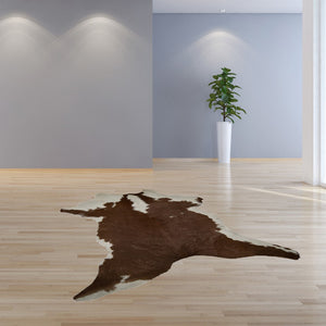 HomeRoots 2' X 3' Hand-Tufted Brown and White Cowhide Print Area Rug - Rustic Charm for Any Space! 293165