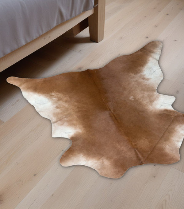 HomeRoots 2' X 3' Tan Print Cowhide Area Rug - Handcrafted Unique Accent for Cozy Living Spaces & Style 293166
