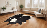 Homeroots Black And White Cowhide Animal Print Area Rug Black,White Cowhide 293172