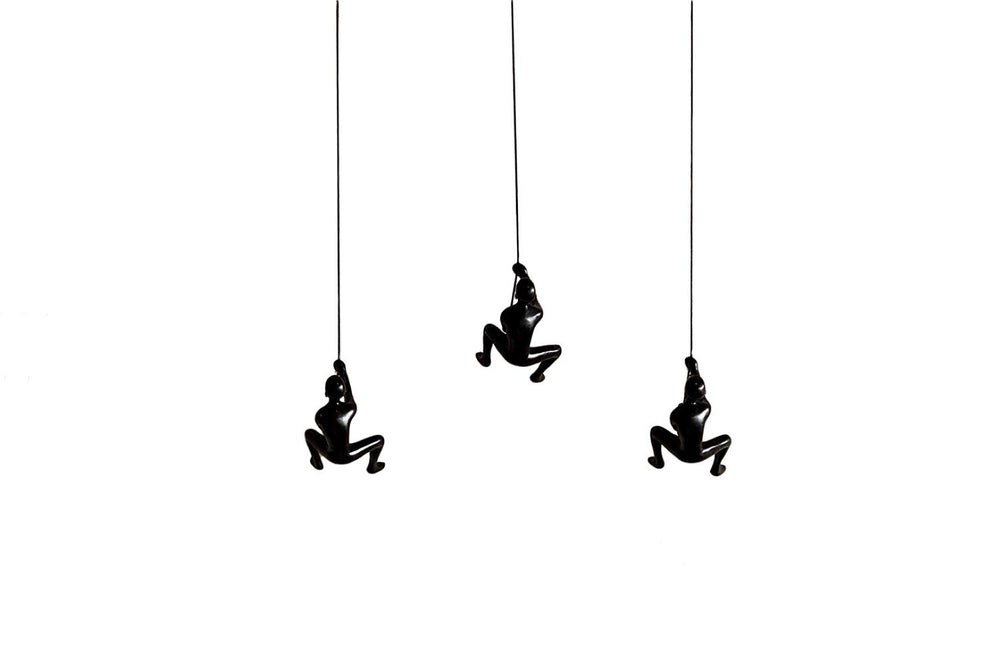 HomeRoots Set of Three Black Resin Climbing Man Sculptures – Modern Wall Art for Dynamic Home Decor Appeal 293220