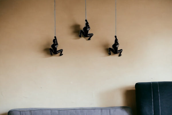 HomeRoots Set of Three Black Resin Climbing Man Sculptures – Modern Wall Art for Dynamic Home Decor Appeal 293220
