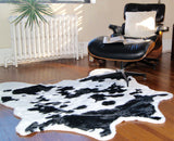 Homeroots 4' X 5' Black And White Faux Cowhide Animal Print Area Rug Sugarland Black,White Faux Cowhide 294242