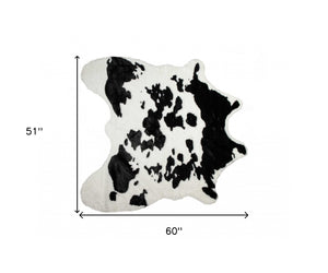 Homeroots 4' X 5' Black And White Faux Cowhide Animal Print Area Rug Sugarland Black,White Faux Cowhide 294242
