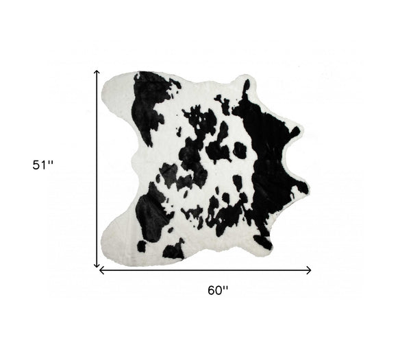 Homeroots 4' X 5' Black And White Faux Cowhide Animal Print Area Rug Sugarland Black,White Faux Cowhide 294242