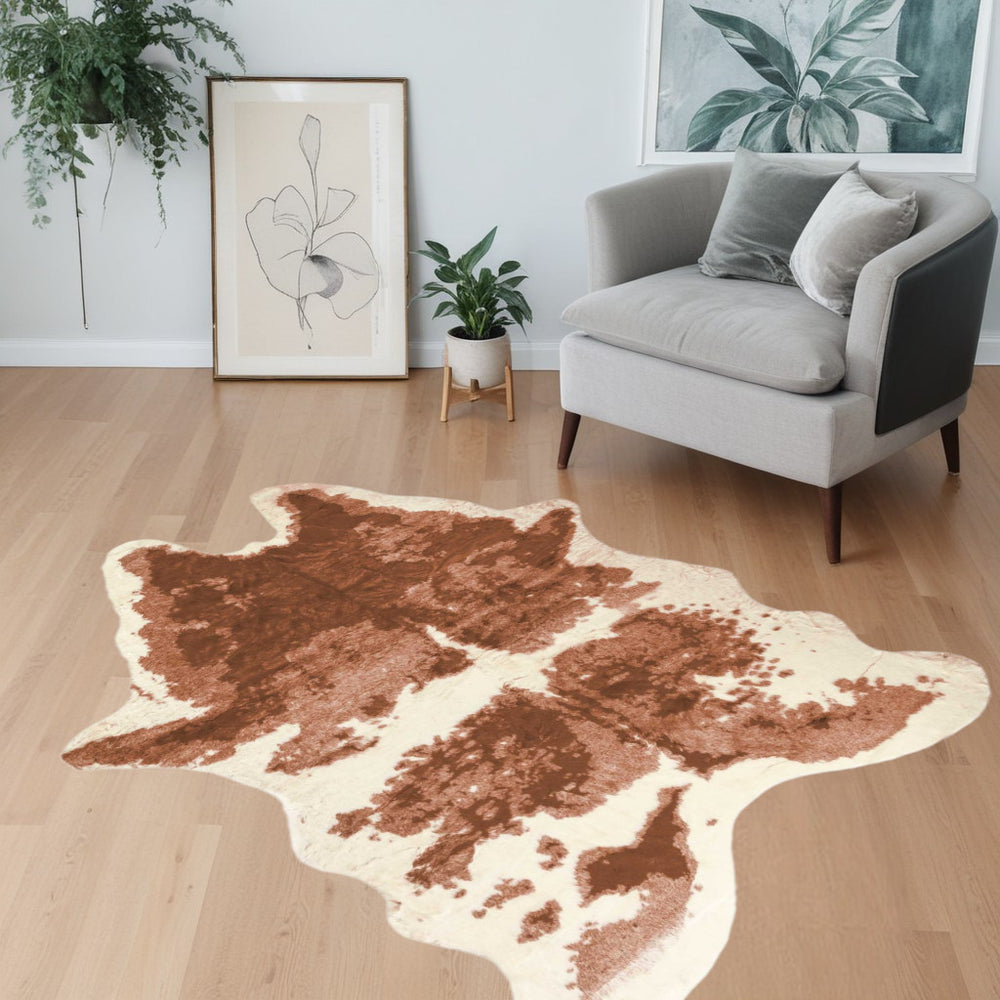 Homeroots 4' X 5' Brown And Ivory Faux Cowhide Animal Print Printed Area Rug  Faux Cowhide 294243
