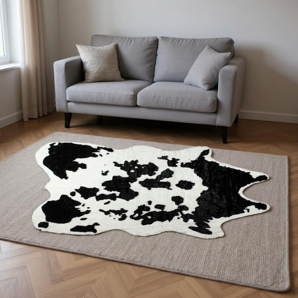 HomeRoots 5' X 8' Black And White Cowhide Print Area Rug - Stylish, Washable, Durable & Perfect for Busy Homes! 294244