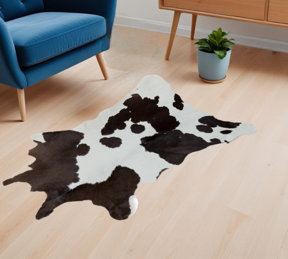 HomeRoots 24" X 36" Luxurious Calfskin Area Rug - Handcrafted Elegance for Timeless Home Décor Style Black/White 316835