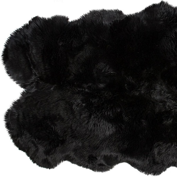 HomeRoots 4' X 6' Genuine Sheepskin Area Rug - Luxurious Softness & Unique Handcrafted Charm for Any Room Black 316898
