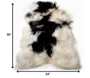 Homeroots 2' X 3' Black And White Spotted Sheepskin Handmade Area Rug  Genuine Sheepskin 316925