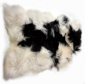 HomeRoots 2' X 3' Black and White Spotted Sheepskin Area Rug - Handmade Artisan Comfort for Cozy Spaces 316925