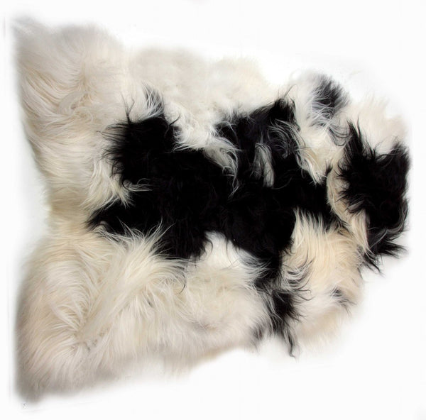 HomeRoots 2' X 3' Black and White Spotted Sheepskin Area Rug - Handmade Artisan Comfort for Cozy Spaces 316925