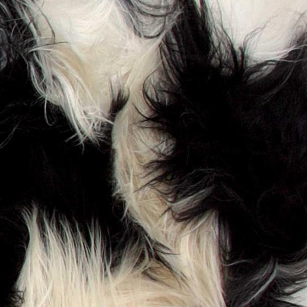 HomeRoots 2' X 3' Black and White Spotted Sheepskin Area Rug - Handmade Artisan Comfort for Cozy Spaces 316925