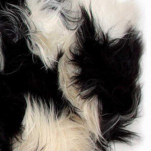 HomeRoots 2' X 3' Black and White Spotted Sheepskin Area Rug - Handmade Artisan Comfort for Cozy Spaces 316925