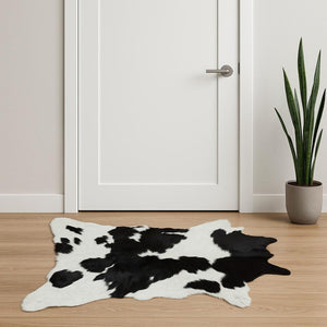 HomeRoots 24" X 36" Calfskin Area Rug – Luxurious Hand-Knotted Brazilian Design for Elegant Interiors Black/White 316960