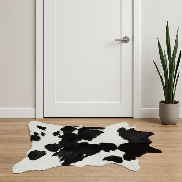 HomeRoots 24" X 36" Calfskin Area Rug – Luxurious Hand-Knotted Brazilian Design for Elegant Interiors Black/White 316960