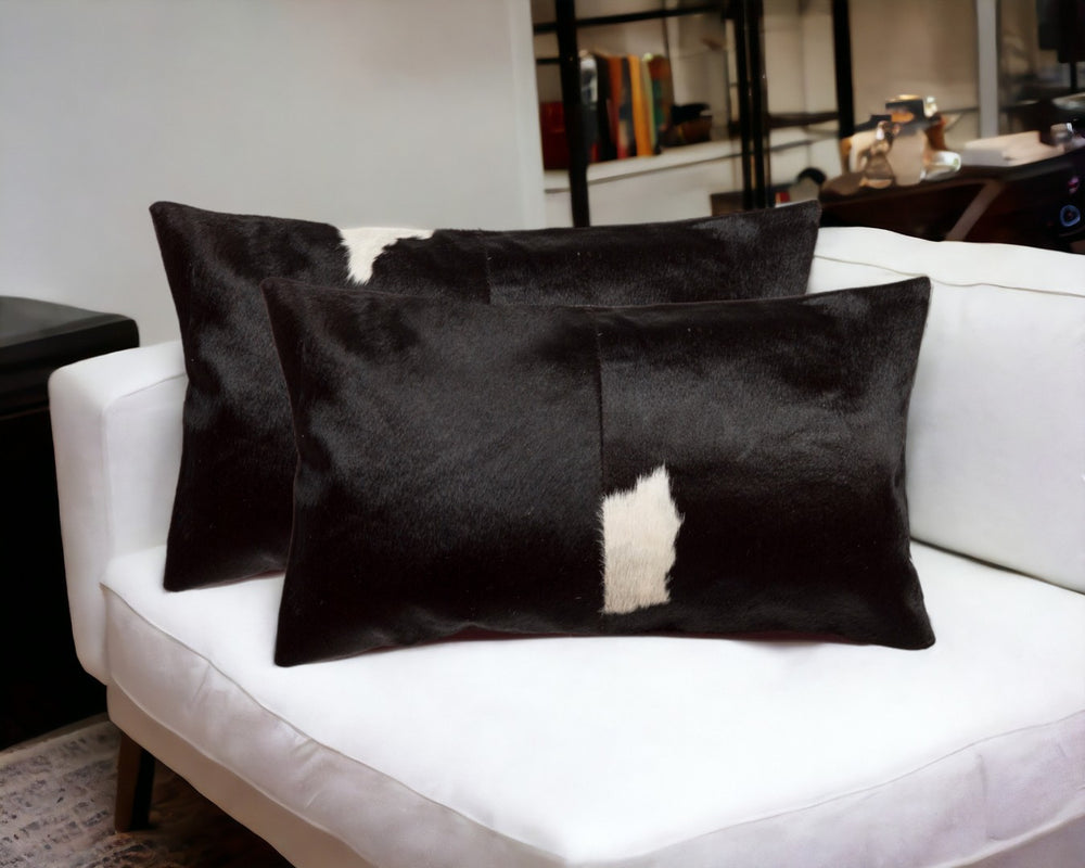HomeRoots Set of Two Luxurious Cowhide Lumbar Throw Pillows for Elegant Home Décor and Comfort Black/White 317129