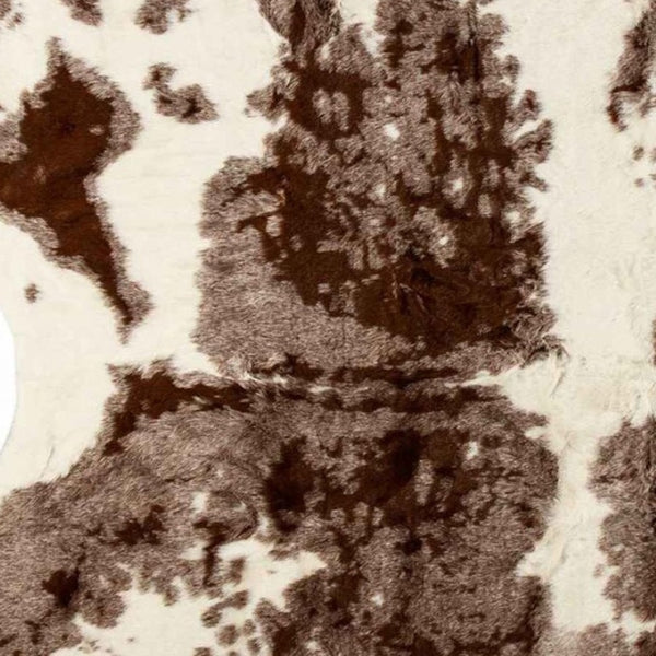 HomeRoots 5' Brown and White Faux Cowhide Area Rug – Rustic Charm & Modern Comfort for Any Room Decor 317166