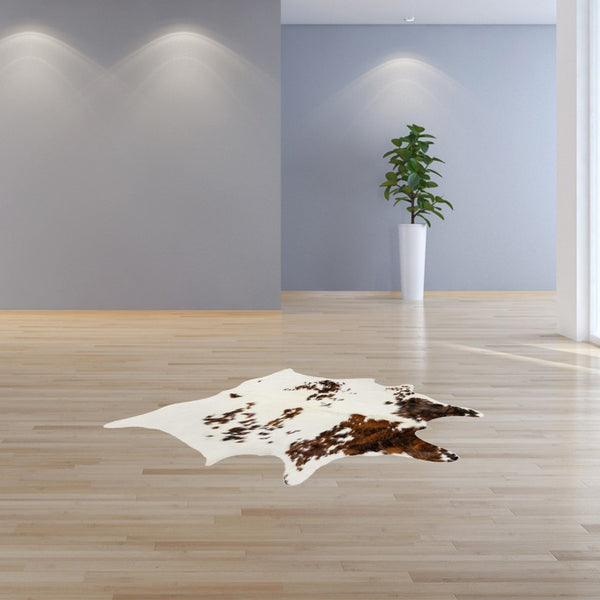 HomeRoots 6' X 7' Brown And White Cowhide Print Area Rug - Rustic Elegance for Modern Interiors & High Traffic Areas 317276