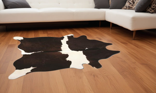 Homeroots 60" X 84" Chocolate And White Cowhide - Area Rug Chocolate,White Cowhide 317323