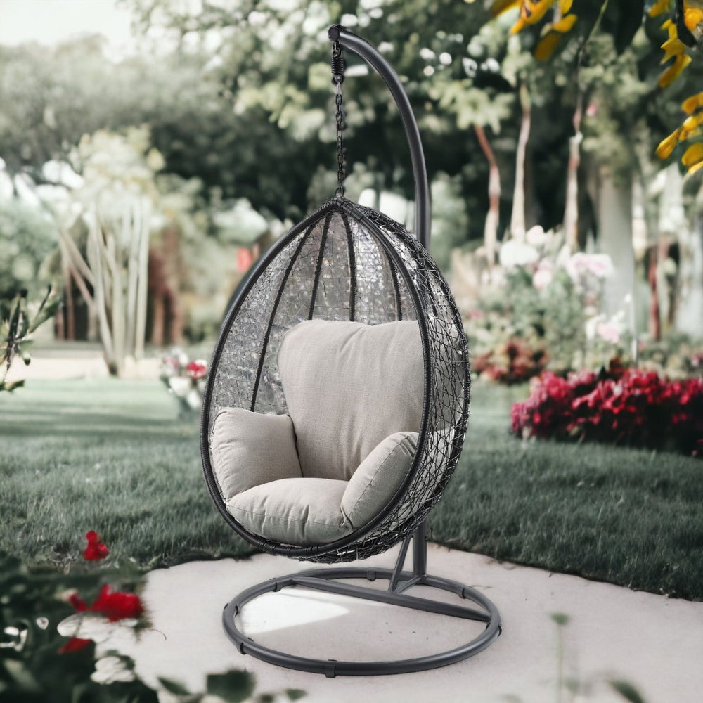 HomeRoots 38" Black Metal Swing Chair with Soft Cushion for Relaxation - Stylish Outdoor and Indoor Seating Beige Fabric And Black 318800