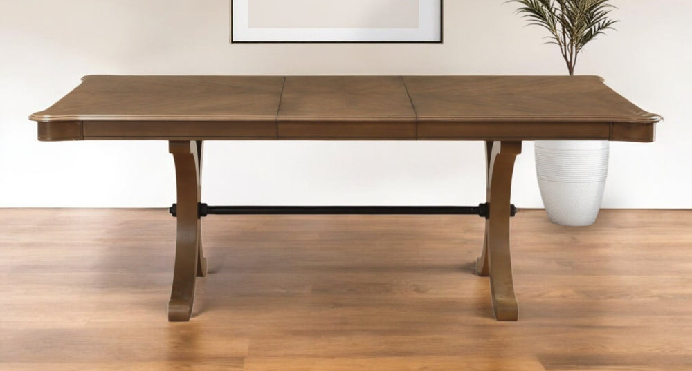 HomeRoots 64" Brown Solid Wood Dining Table with Removable Leaf – Elegant Trestle Base for Timeless Style 318936