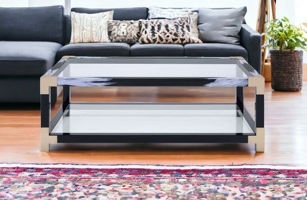 Homeroots 54" Clear And Black And White Glass And Metal Coffee Table With Shelf   318998