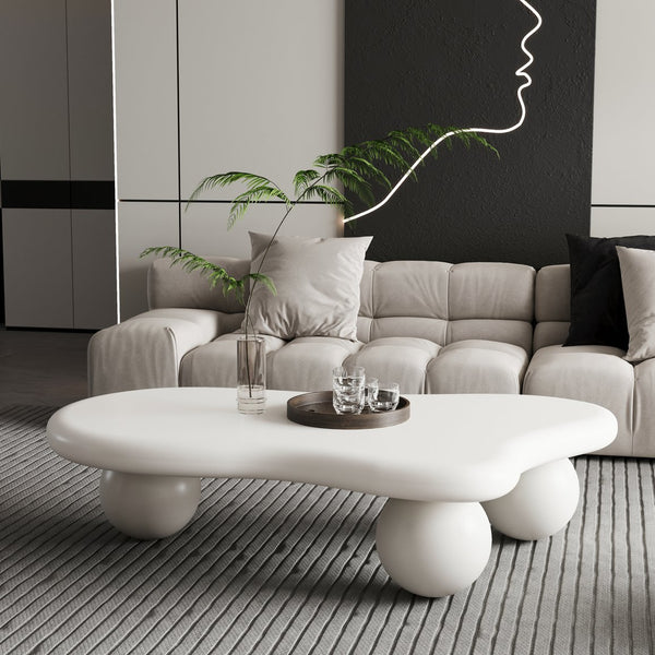 English Elm 47 Inch Cloud-Shaped Coffee Table With Elegant Cream Finish & 3 Ball Legs For Modern Living Spaces W1435S00014