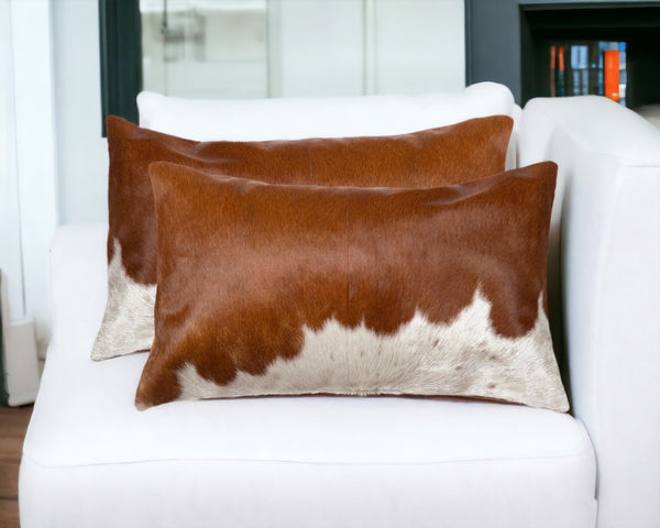 HomeRoots Set of Two Luxurious Cowhide Lumbar Throw Pillows for Elegant Home Décor and Comfort Brown/White 328290