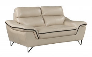 Homeroots 69" Beige And Silver Faux Leather Love Seat   329492