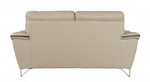 Homeroots 69" Beige And Silver Faux Leather Love Seat   329492