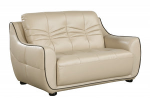 Homeroots 69" Beige And Black Faux Leather Love Seat   329508