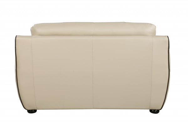 Homeroots 69" Beige And Black Faux Leather Love Seat   329508
