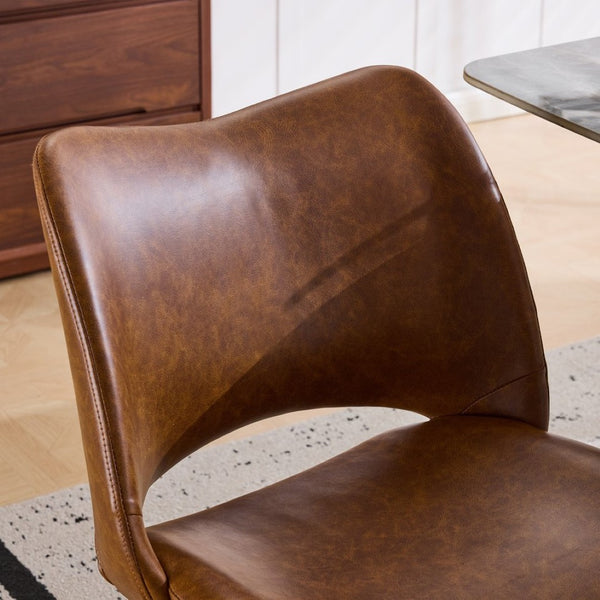 English Elm The Swivel Dining Chair with Hollow Cutout Back Faux Leather Hardwood Frame Modern Brown W3612P436512