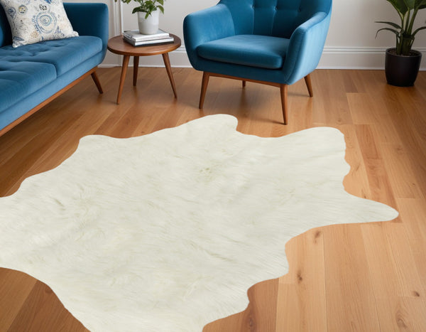 Homeroots 4' X 5' Off White Faux Cowhide Animal Print Cowhide Area Rug  Faux Cowhide 332248