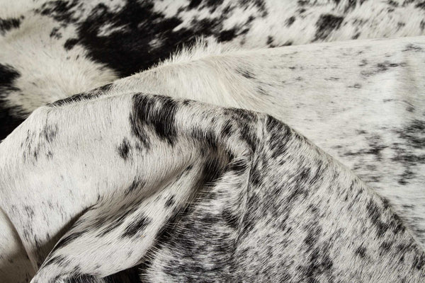 HomeRoots 6' Black and White Cowhide Area Rug - Unique, Durable, and Stylish for Modern Homes and Interiors 332280