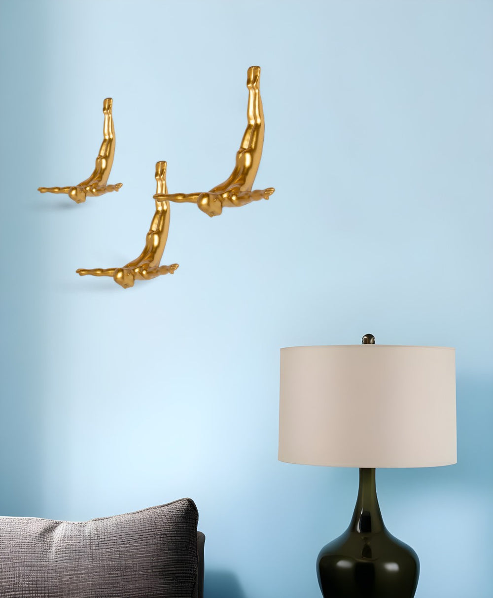 HomeRoots Set of Three Dimensional Diving Man Wall Sculptures for Modern Home Decor and Artistic Flair Gold 332362